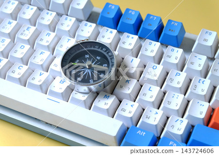 Vintage compass on computer key board ,business decision. 143724606