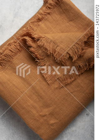 Folded Terracotta Fringed Linen Tablecloth Folded Terracotta Fringed Linen Tablecloth 143725972