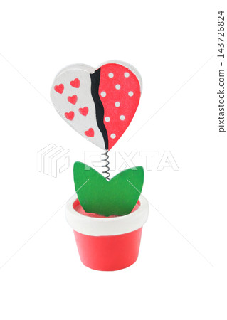 Wooden heart-shaped flower isolated on a white background. Gift for Valentine's Day. Wooden heart-shaped flower isolated on a white background. Gift for Valentine's Day. 143726824
