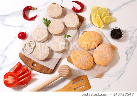 Frozen raw patties for quick preparation patties made from a variety of minced meats, seasoned with onion, tomato, lemon, garlic, and pepper , recipe for appetizing schnitzels and beefsteaks, Frozen raw patties for quick preparation patties made from a variety of minced meats, seasoned with onion, tomato, lemon, garlic, and pepper , recipe for appetizing schnitzels and beefsteaks, 143727547