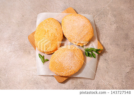 Frozen raw patties for quick preparation . Soy meat patties,vegetarian and vegan food, onion, tomato, lemon, garlic,recipe for appetizing schnitzels and beef steaks, menu options for a cafe Frozen raw patties for quick preparation . Soy meat patties,vegetarian and vegan food, onion, tomato, lemon, garlic,recipe for appetizing schnitzels and beef steaks, menu options for a cafe 143727548