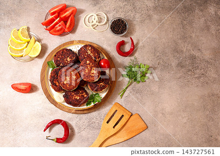 Homemade patties made from ground beef and pork featuring onion, tomato, lemon, garlic, recipe for delicious schnitzels and beef steaks, menu options for cafe , banner for fastfood establishment Homemade patties made from ground beef and pork featuring onion, tomato, lemon, garlic, recipe for delicious schnitzels and beef steaks, menu options for cafe , banner for fastfood establishment 143727561