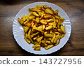 Fried potatoes with smoked paprika in pan 143727956