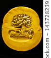 Close-Up Half Pumpkin With Seeds And Vibrant Orange Flesh On Black Background, Autumn Harvest Produce 143728239