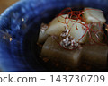 Simmered daikon radish with minced meat. A Japanese simmered dish served in a blue bowl. 143730709