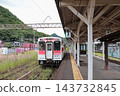 A Matsuura Railway Nishikyushu Line train stopped at the platform of Arita Station. 143732845