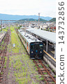 A JR Kyushu YC1 series diesel railcar stopped at the platform of Arita Station. 143732856