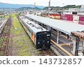 A JR Kyushu YC1 series diesel railcar stopped at the platform of Arita Station. 143732857