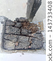 close up of rotten wood and some nails and walls  143733408