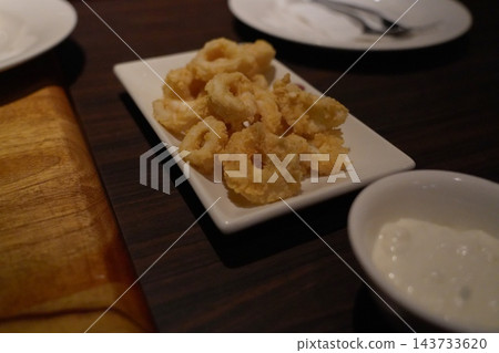 Crispy Golden Fried Calamari Rings with Dipping Sauce 143733620