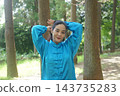A young woman batting forest A young woman batting forest 143735283