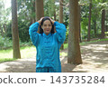 A young woman batting forest A young woman batting forest 143735284