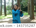 A young woman batting forest A young woman batting forest 143735287