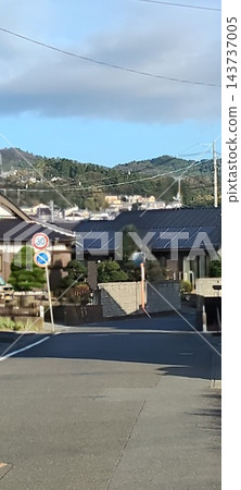 A small mountain and clouds visible in the distance A small mountain and clouds visible in the distance 143737005