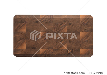 Handmade stacked cutting board from black walnut with oil finish isolated Handmade stacked cutting board from black walnut with oil finish isolated 143739989