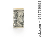 Pack of dollars rolled with a rubber band isolated 143739998