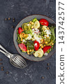 Mediterranean chickpea pasta salad with fresh vegetables 143742577
