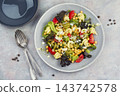 Mediterranean chickpea pasta salad with fresh vegetables 143742578