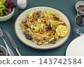 Spaghetti with mussels and fresh greens 143742584