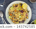 Mediterranean spaghetti with mussels and lemon 143742585