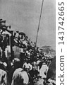 Old photograph, September 1923, Tabata Station, Tokyo: People crammed onto a steam locomotive to take refuge immediately after the Great Kanto Earthquake. 143742665