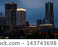 The city night view of Yokohama Minato Mirai, with its glittering skyscrapers and red brick warehouses at dusk. The city night view of Yokohama Minato Mirai, with its glittering skyscrapers and red brick warehouses at dusk. 143743698