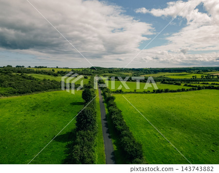 Aerial view of The Waterford Greenway, also known as the Deise Greenway, a scenic cycling and hiking trail following a former railway line through the countryside of County Waterford, Ireland Waterfor Aerial view of The Waterford Greenway, also known as the Deise Greenway, a scenic cycling and hiking trail following a former railway line through the countryside of County Waterford, Ireland Waterfor 143743882