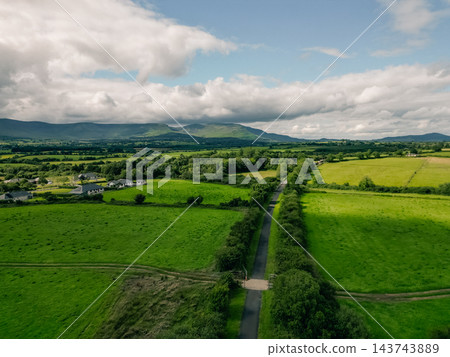 Aerial view of The Waterford Greenway, also known as the Deise Greenway, a scenic cycling and hiking trail following a former railway line through the countryside of County Waterford, Ireland Waterfor Aerial view of The Waterford Greenway, also known as the Deise Greenway, a scenic cycling and hiking trail following a former railway line through the countryside of County Waterford, Ireland Waterfor 143743889