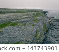 Aerial view of The Burren, a dramatic limestone landscape in County Clare, western Ireland, featuring rugged rocky terrain, green fields and distinctive karst Clare, Ireland - 28 August 2026 143743901