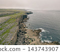 Aerial view of The Burren, a dramatic limestone landscape in County Clare, western Ireland, featuring rugged rocky terrain, green fields and distinctive karst Clare, Ireland - 28 August 2026 143743907