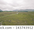 Aerial view of Lough Bofin in the Connemara region of County Galway, Ireland, surrounded by rugged mountains, green countryside and tranquil waters Galway, Ireland - 28 August 2026. 143743912