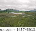 Aerial view of Lough Bofin in the Connemara region of County Galway, Ireland, surrounded by rugged mountains, green countryside and tranquil waters Galway, Ireland - 28 August 2026. 143743913