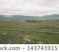 Aerial view of Lough Bofin in the Connemara region of County Galway, Ireland, surrounded by rugged mountains, green countryside and tranquil waters Galway, Ireland - 28 August 2026. 143743915