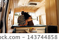 Mature couple enjoying van life adventure together 143744858