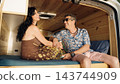 Mature couple enjoying van life adventure together 143744909