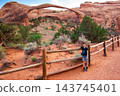 Landscape Arch with Young Tourist Boy 143745401