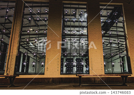 The nostalgic window view of JR Otaru Station, with its glittering lamplights seen through the glass from the platform at night. The nostalgic window view of JR Otaru Station, with its glittering lamplights seen through the glass from the platform at night. 143746083