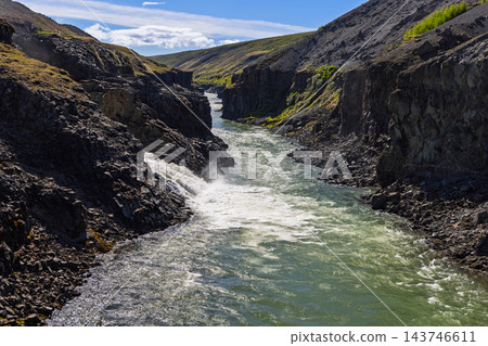 Basalt gorge scenery framing Jokla river rapids at Studlagil canyon, East Iceland Basalt gorge scenery framing Jokla river rapids at Studlagil canyon, East Iceland 143746611