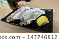 Raw oysters in the shell and lemon 143746812