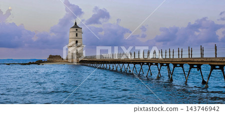 Alexandria Egypt Lighthouse and Mediterranean Sea at Sunset, Peaceful Seascape with Historic Pier, Magical Clouds, Amazing Sky, Solitude, Calm Alexandria Egypt Lighthouse and Mediterranean Sea at Sunset, Peaceful Seascape with Historic Pier, Magical Clouds, Amazing Sky, Solitude, Calm 143746942