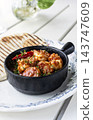 Prawns Pil Pil famous spanish traditional spicy tapas dish on outdoor restaurant table in ibiza spain 143747609