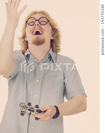 Gamer man holding gaming pad 143750186