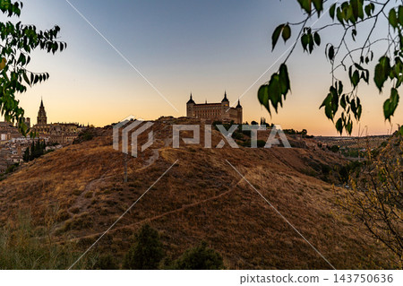 Sunset Silhouette of Toledo Cathedral and Alcazar Skyline 143750636