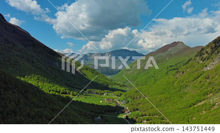 Rocky snow mountains and green valley aerial 143751449