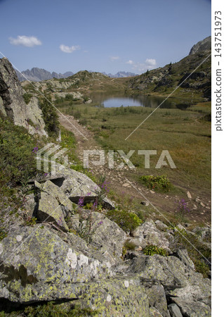French alps mountain lake and hiking trail 143751973