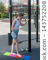 A woman with cerebral palsy walks on sensory mats. Rehabilitation 143752208