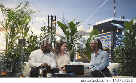 Cheerful business partners shaking hands during meeting on rooftop workspace. Businesspeople doing handshake, excited to start working together on finalizing deal Cheerful business partners shaking hands during meeting on rooftop workspace. Businesspeople doing handshake, excited to start working together on finalizing deal 143753198