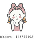 A woman with a headband smiles and puts her hand to her cheek. 143755198