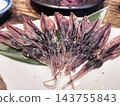 Dried firefly squid arranged on a plate 143755843
