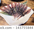 Dried firefly squid arranged on a plate 143755844